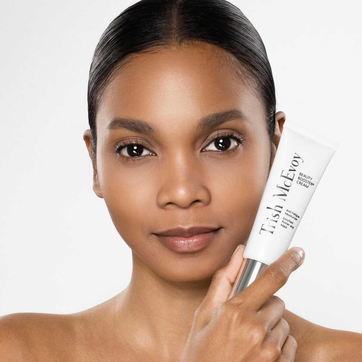 Trish McEvoy cream in use beside makeup bag for pre-makeup priming benefit