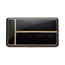 Trish McEvoy compact front packaging showing elegant case and brand logo for portability
