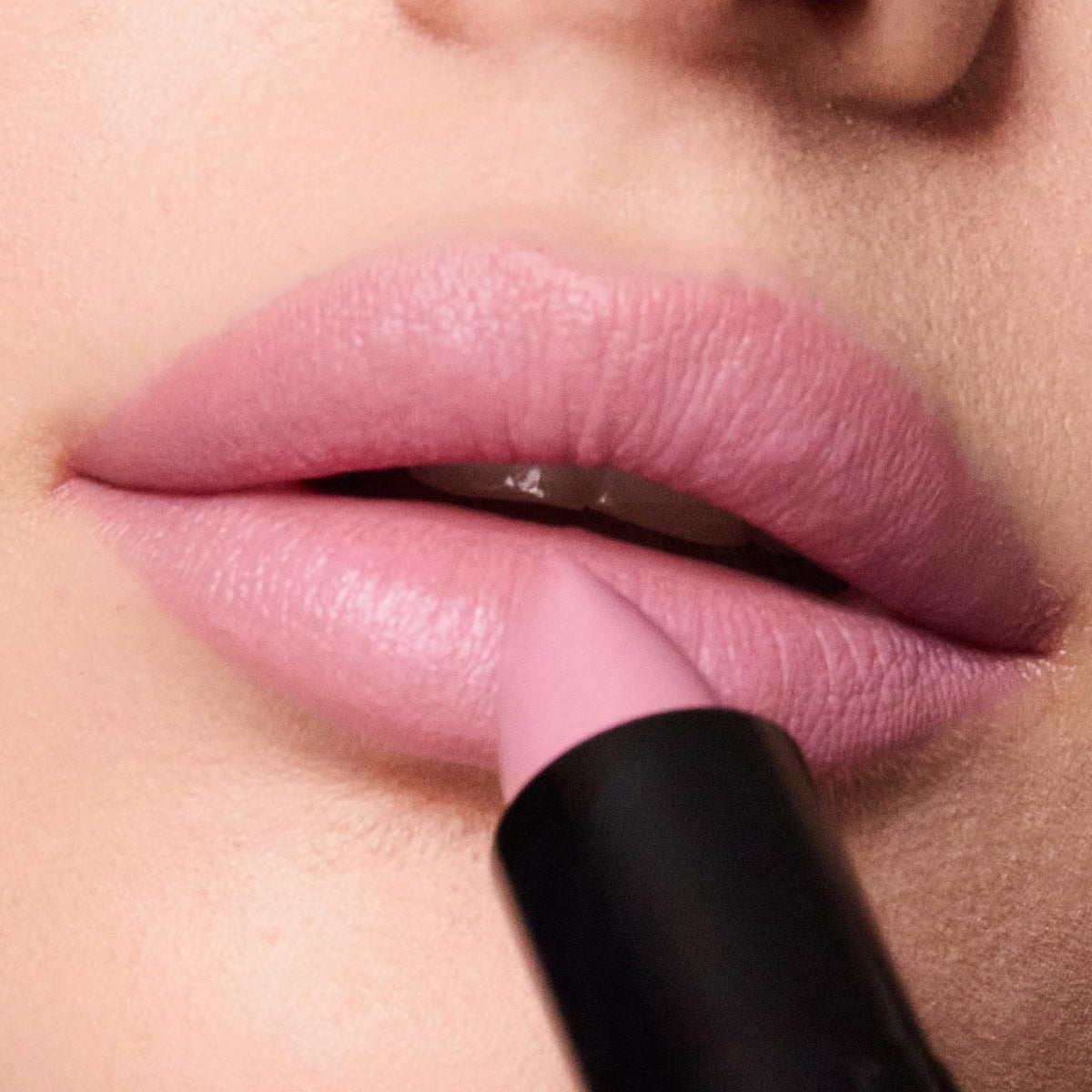Trish McEvoy model applying Dolled Up for quick, effortless polish