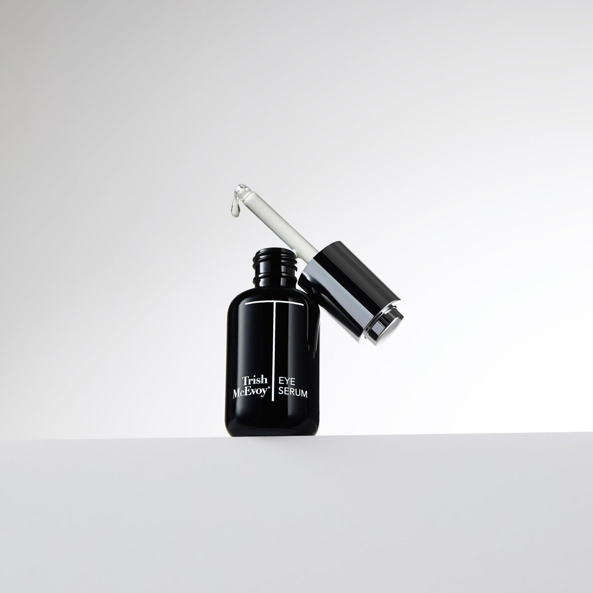 Trish McEvoy serum texture on fingertip highlighting lightweight hyaluronic hydration benefit