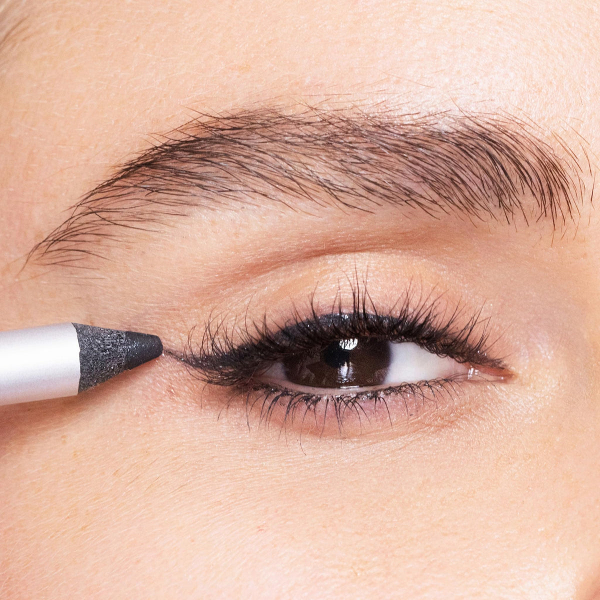 Trish McEvoy applying liner on upper lashline illustrating precision and long-wear