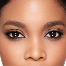 Trish McEvoy liner in a makeup bag lifestyle shot highlighting portability benefit