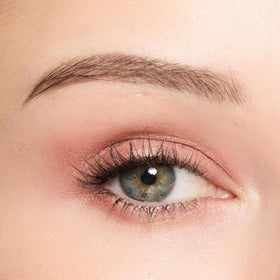 Trish McEvoy product applied on eyelid demonstrating crease-resistant color benefit