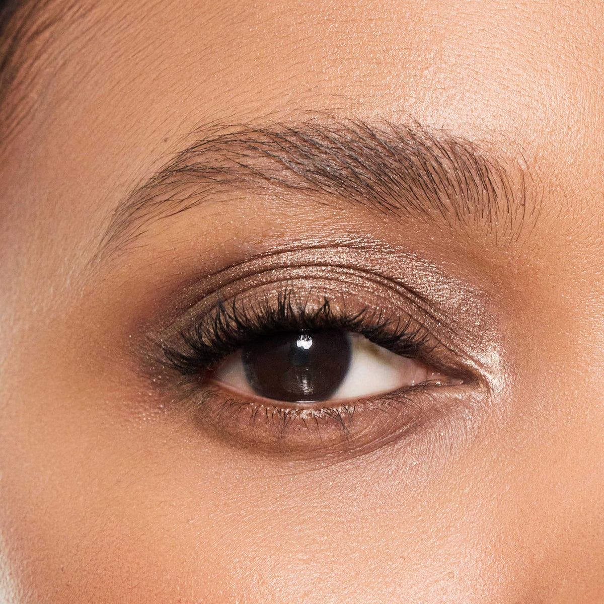 Trish McEvoy Topaz stick in a makeup bag lifestyle scene for quick touch-ups