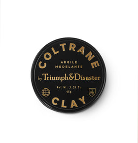 TRIUMPH & DISASTER tin front showing sleek packaging and premium finish benefit