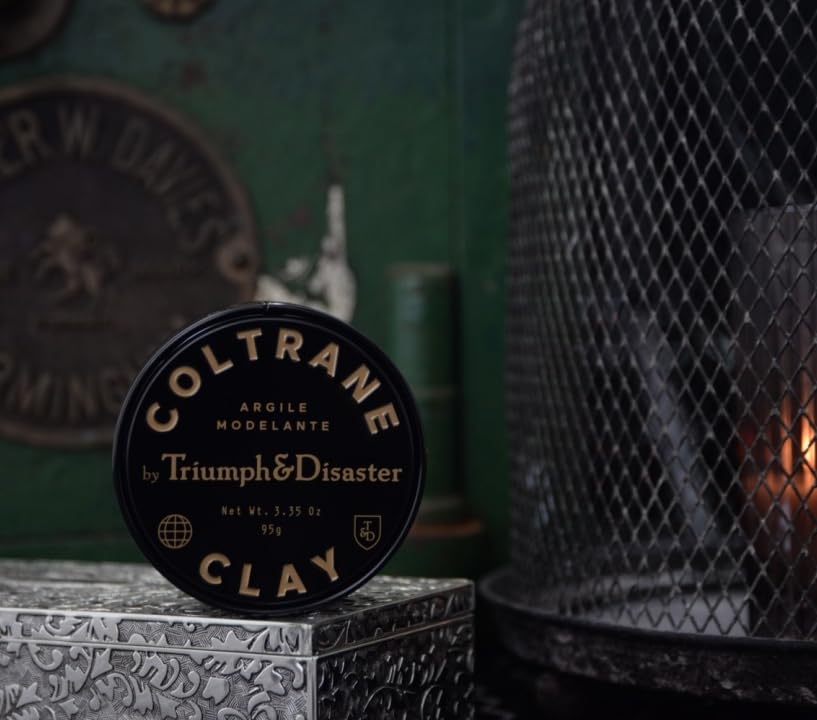 TRIUMPH & DISASTER label close-up revealing smoky-earth scent notes and premium branding