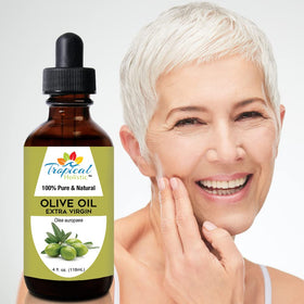 Applying Tropical Holistic oil to hands and face for hydration benefit