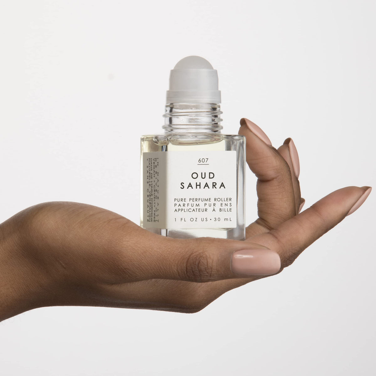 Tru Fragrance Beauty perfume oil texture on skin showing smooth absorption benefit: long-lasting scent
