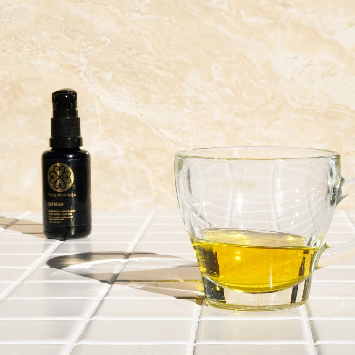 True Moringa size comparison showing compact 30 ml travel bottle