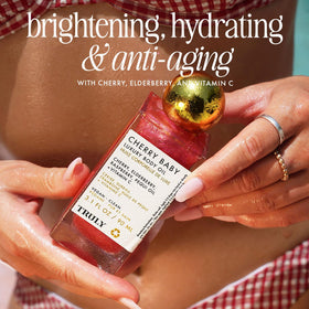 Truly Cherry Baby texture drop on hand showing lightweight absorption benefit