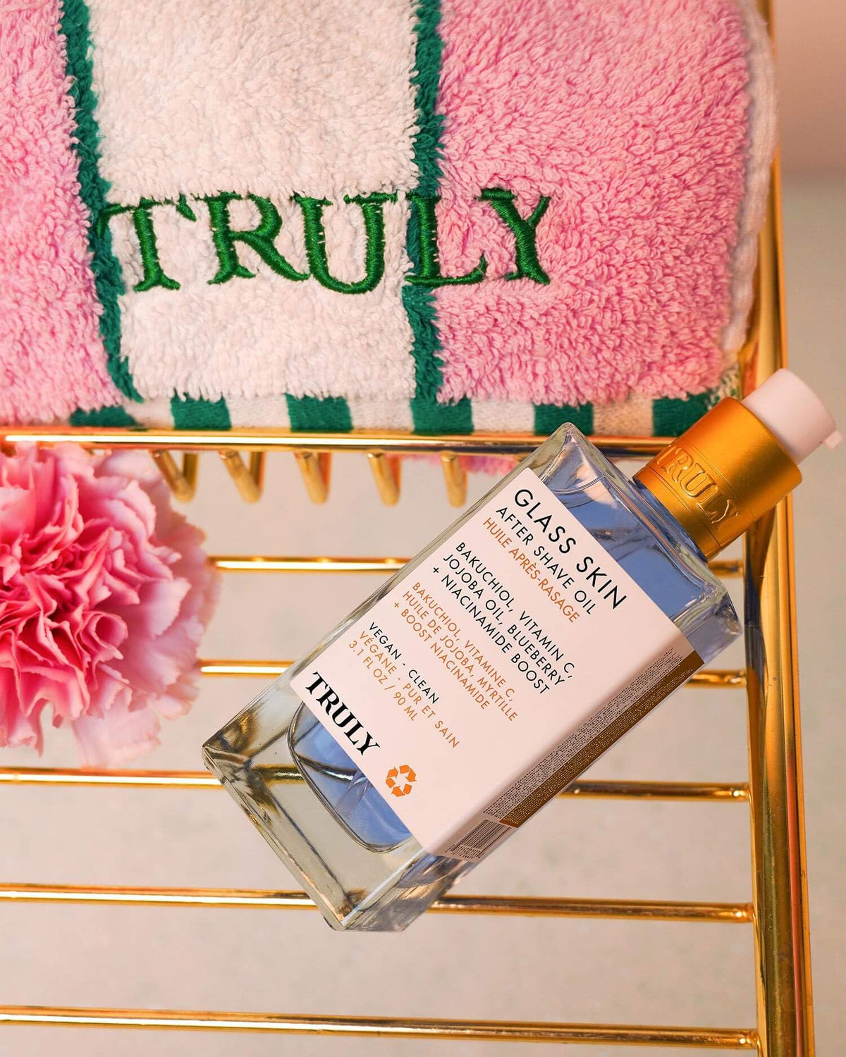 Truly bottle beside razor to show size and post-shave routine benefit