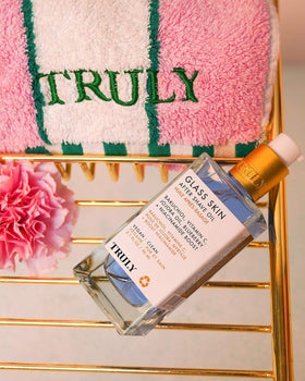 Truly bottle beside razor to show size and post-shave routine benefit