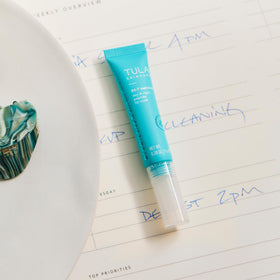 TULA lip mask on nightstand illustrating nighttime repair and restful hydration