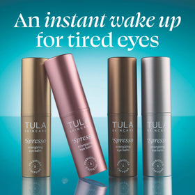 TULA Spresso eye balm golden texture swipe on skin showing luminous finish and hydration
