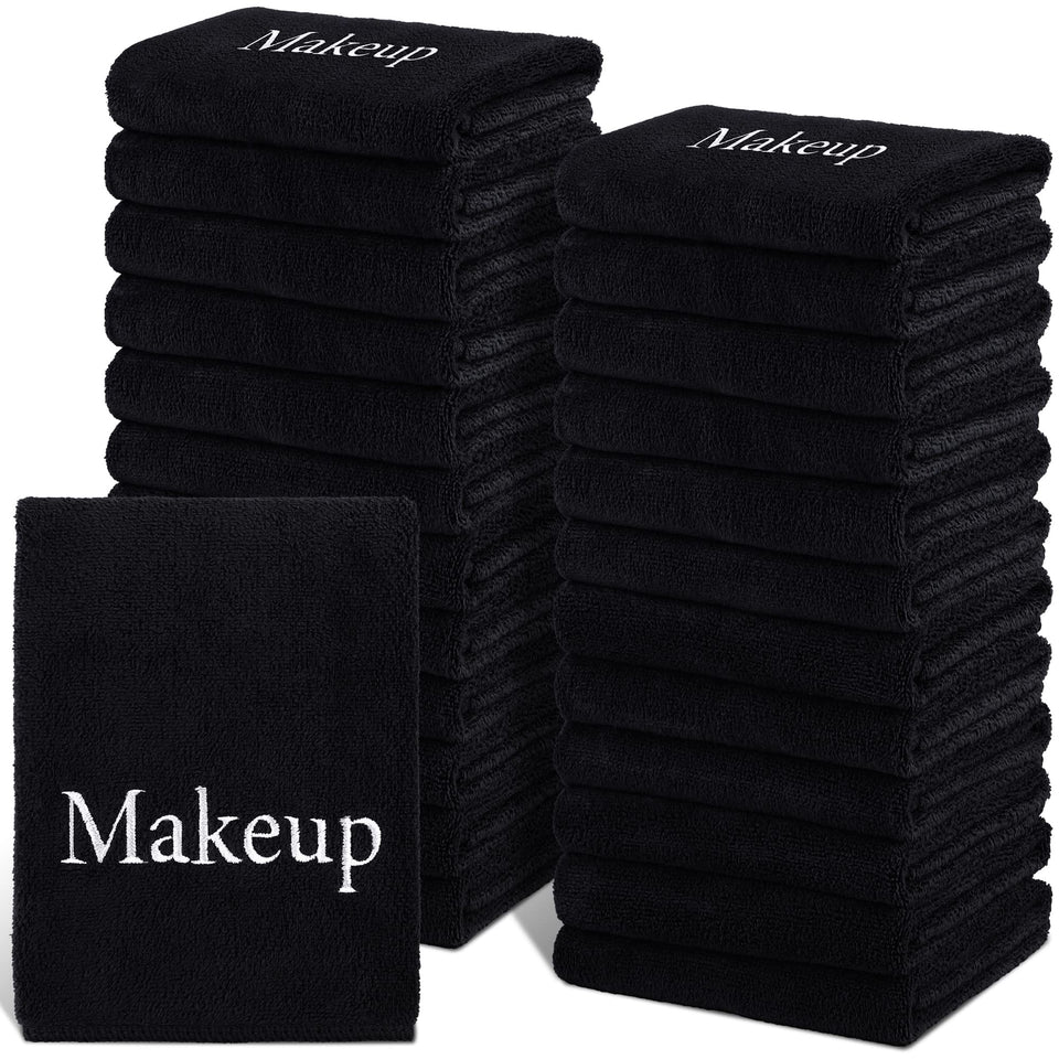 TURSTIN front stack of 24 black towels showing bulk supply benefit