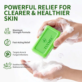 Tuymec bar in hand lathering to clean and treat skin