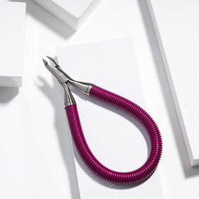 Tweezerman spiral spring detail showing smooth recoil for reduced hand fatigue benefit