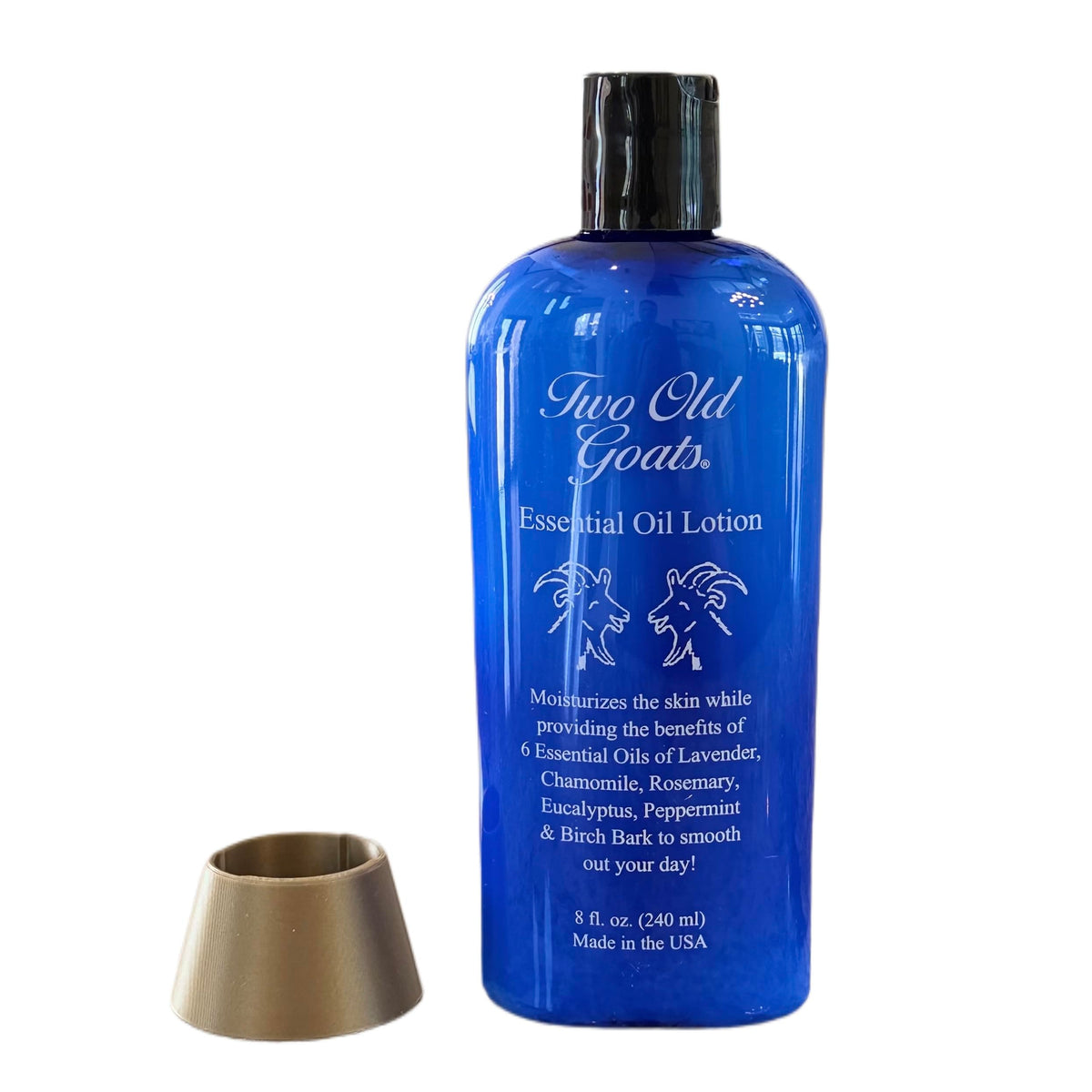 Two Old Goats front packaging showing 8oz bottle and upside-down holder for easy dispensing