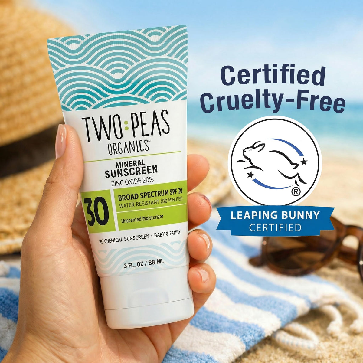 Two Peas Organics applying sunscreen on baby arm for gentle protection