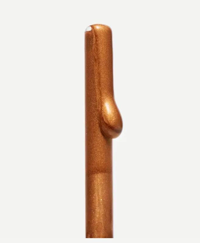 Typology bronzing drops mixed with moisturizer in hand demonstrating customizable radiance