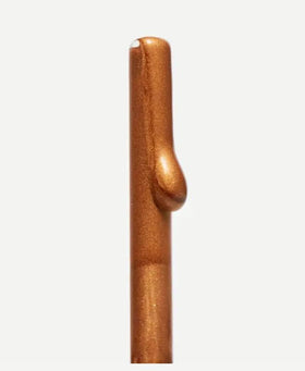 Typology bronzing drops mixed with moisturizer in hand demonstrating customizable radiance