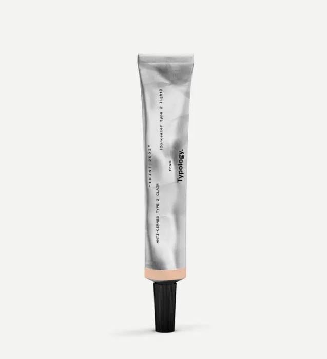 Typology compact bottle front view showing shade and applicator, brightening benefit