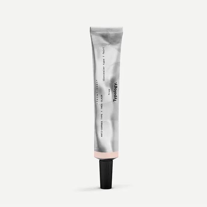 Typology concealer Type 1 front packaging showing compact bottle and applicator benefit brightening