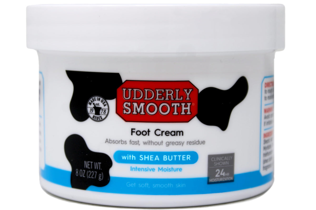 Udderly Smooth open tub close-up texture highlighting shea butter-rich, fast-absorbing cream
