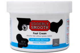 Udderly Smooth open tub close-up texture highlighting shea butter-rich, fast-absorbing cream