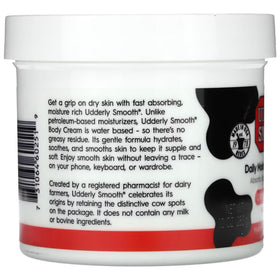 UDDERLY SMOOTH 10 oz jar held in hand showing true size and portability benefit