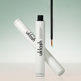 UKLASH bottle with box in lifestyle setting suggesting travel-friendly care