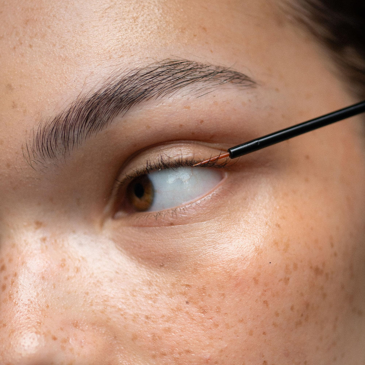 UKLASH sensitive next to lash extensions demonstrating compatibility with extensions