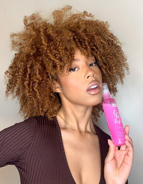 Umberto Giannini curl jelly being scooped into a hand for controlled, no-waste application