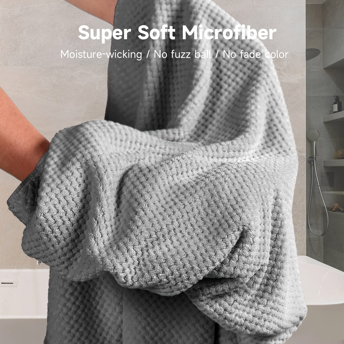 Umisleep towel size comparison with hands showing full coverage benefit