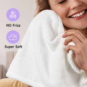 Umisleep turban worn by woman in bathroom enabling multitasking while drying
