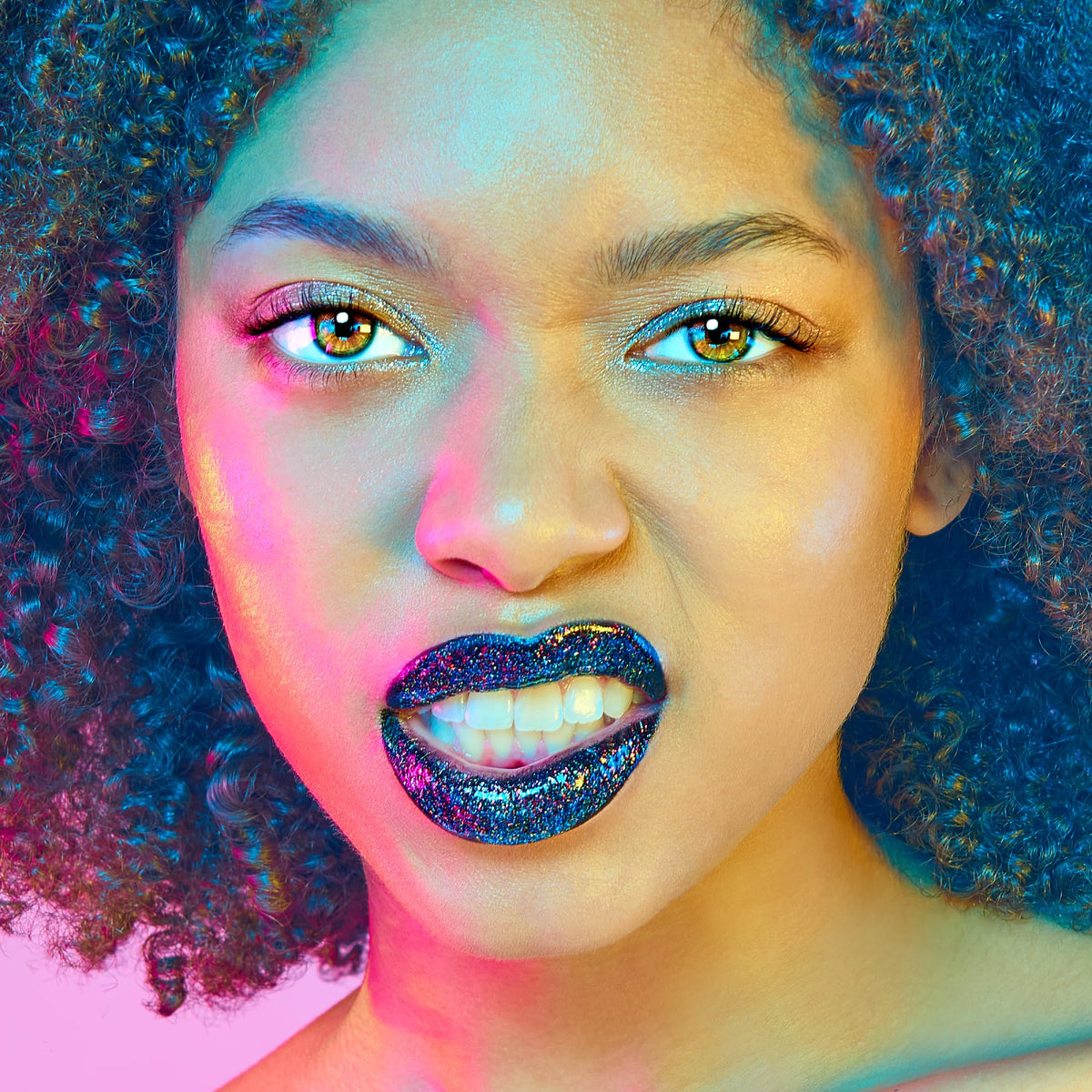 UNICORN SNOT model wearing Chasm duo at night showcasing dramatic long-lasting shine