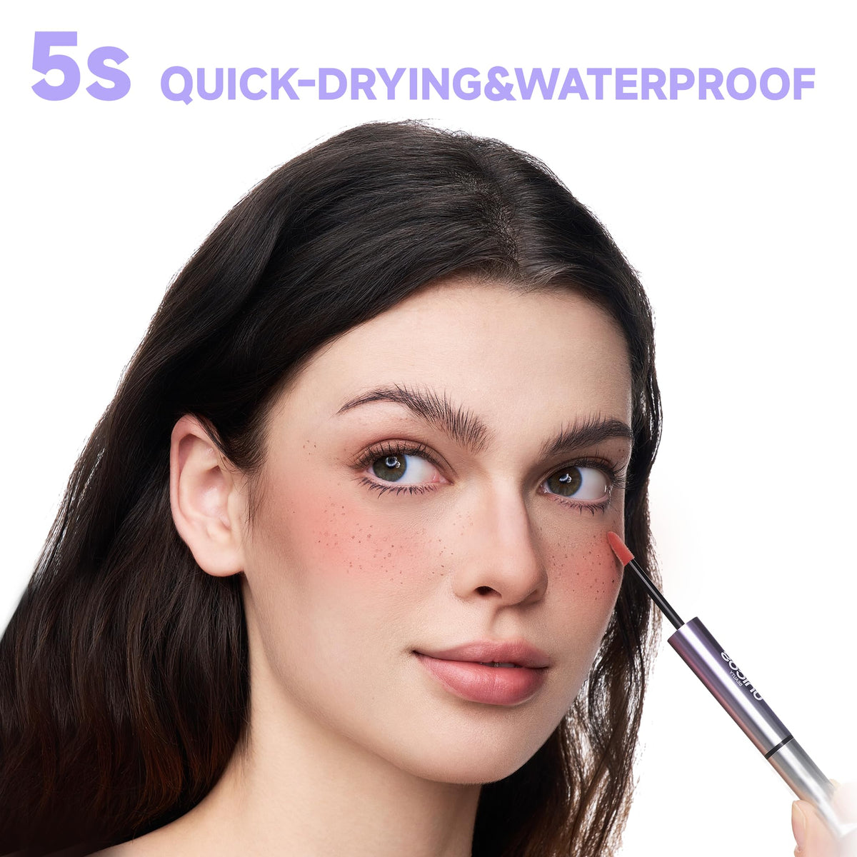 Unicos freckle stamp in use on cheeks for realistic sun-kissed freckles