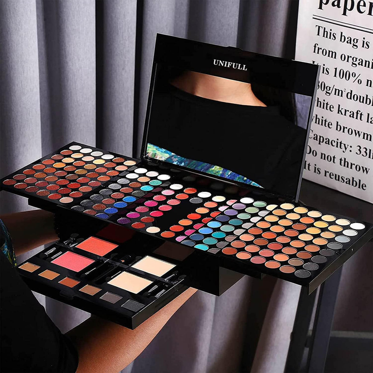 UNIFULL held in hand to show compact scale and travel-friendly design