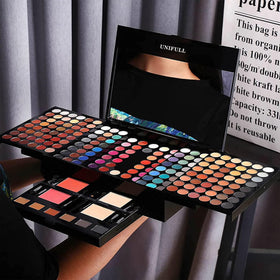 UNIFULL held in hand to show compact scale and travel-friendly design