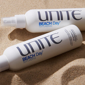 UNITE bottle next to a hand showing 8oz scale for travel-friendly styling benefit