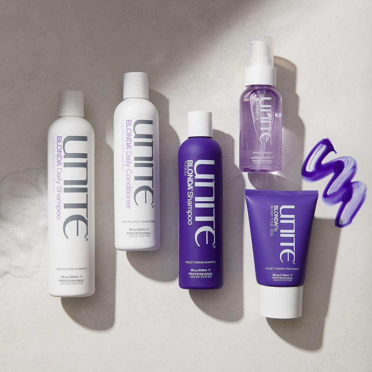 UNITE BLONDA on bathroom shelf styled with towels showing salon-quality care