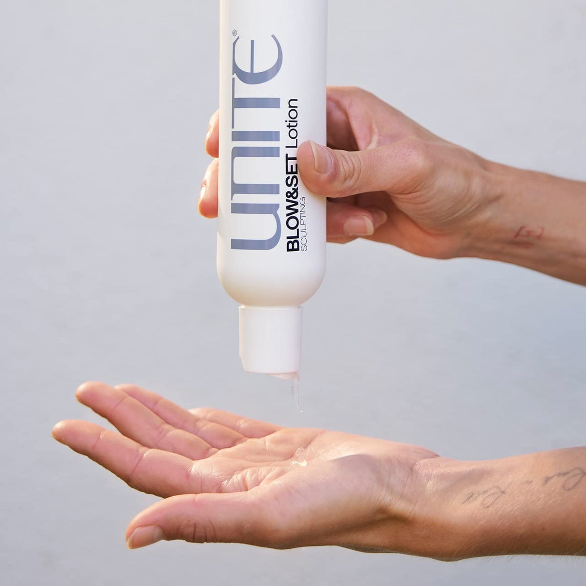 UNITE product used during blow-drying to show volume creation and heat activation
