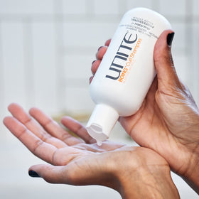 UNITE BOING bottle on bathroom shelf in routine setting, conveys salon-grade results