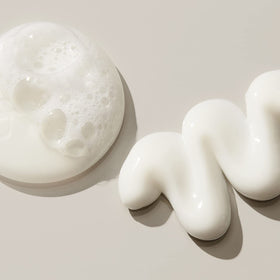 UNITE LAZER Straight shampoo lather in shower demonstrating gentle cleanse and frizz control benefit