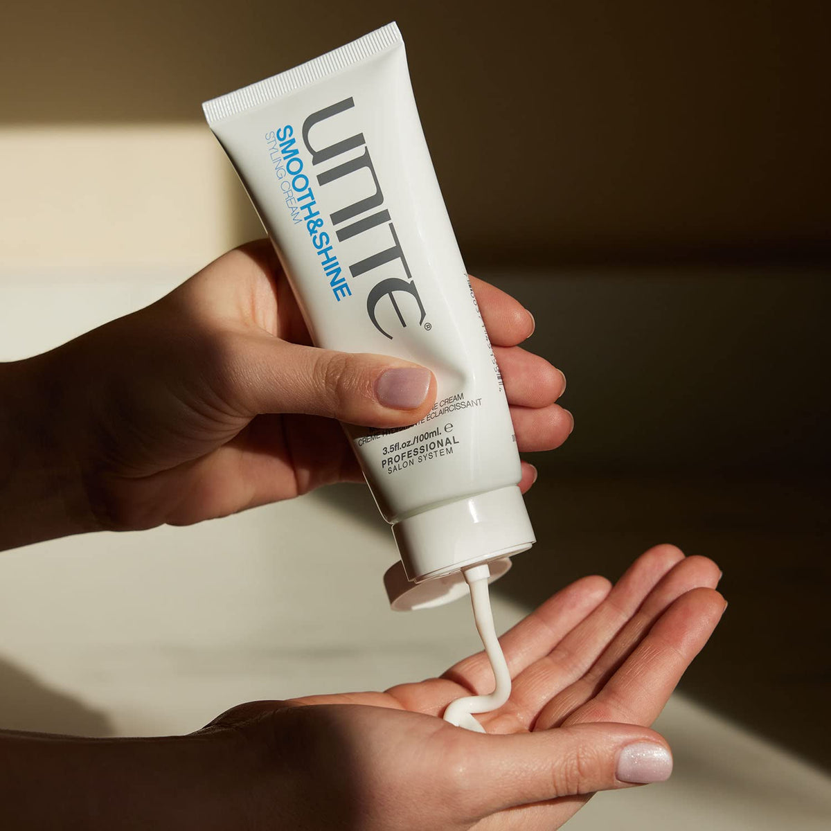 UNITE smooth&shine being applied to damp hair for faster blow-dry
