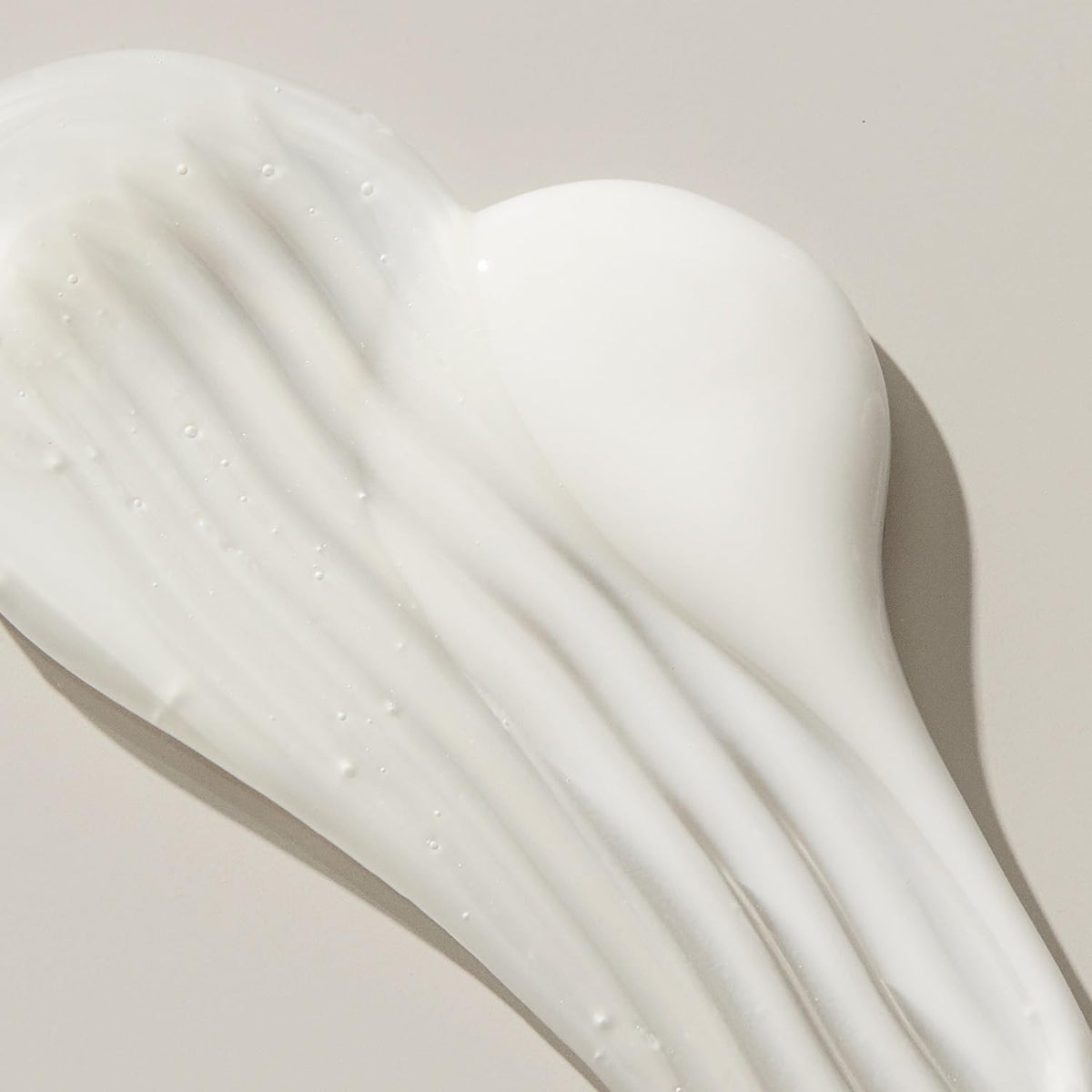UNITE U LUXURY on shower shelf in bathroom for salon-quality hydration