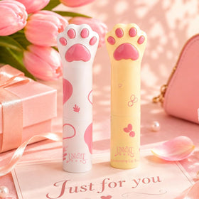 UNQCAT+ close-up of balm texture on finger showing smooth moisturizing finish