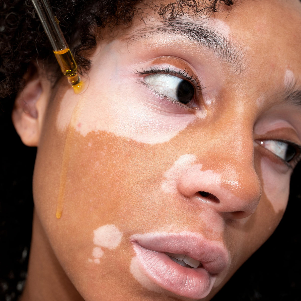 UpCircle oil texture on skin, illustrating lightweight absorption and hydrated finish