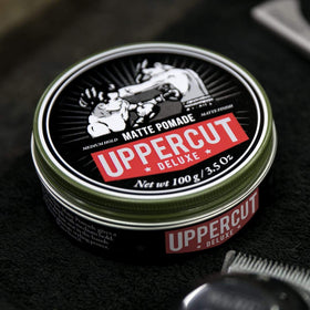 UPPERCUT DELUXE in barber shop lifestyle shot illustrating professional styling result