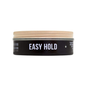 Uppercut Deluxe pomade on fingers demonstrating effortless application control